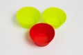 Yellow and red silicone molds for baking a cupcake on a white background Royalty Free Stock Photo