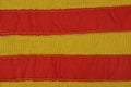 Yellow red striped fabric texture from an old piece of clothing Royalty Free Stock Photo