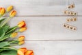 Yellow and red tulips on whitewashed wood with Mother`s Day mess Royalty Free Stock Photo