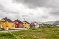 Yellow, red and white norwegian houses along the road in Andenes village, Andoy Municipality, Vesteralen district, Nordland county