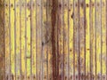 Yellow reddish weathered wooden wall with peeling paint v2