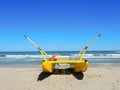 Yellow rescue boat on Italian beach. Adriatic sea. Emilia Romagna. Italy Royalty Free Stock Photo