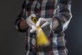 Yellow retractable tape measure tool in hands of repairman, closeup Royalty Free Stock Photo