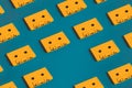 Yellow Retro Audio Cassette Tapes On Blue Background, Flat Lay. Creative Concept Of Retro Technology