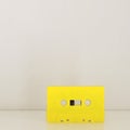 Yellow retro audio cassette Royalty Free Stock Photo