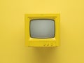 Yellow retro monitor with a ray tube on a yellow background. Flat lay