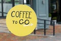 Yellow retro outdoor sign coffee to go in the morning