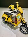 Yellow retro vespa motorcycle Royalty Free Stock Photo