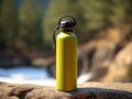 Yellow reusable steel thermo water bottle on the background of the waterfall. Generative AI