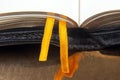 Yellow ribbon bookmark for a book. Open bible. The study of literature Royalty Free Stock Photo