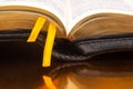 Yellow ribbon bookmark for a book. Open bible. The study of literature Royalty Free Stock Photo
