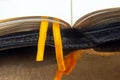 Yellow ribbon bookmark for a book. Open bible. The study of literature Royalty Free Stock Photo