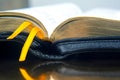 Yellow ribbon bookmark for a book. Open bible. The study of literature Royalty Free Stock Photo
