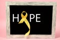 Yellow ribbon symbolic color for Sarcoma Bone cancer awareness and suicide prevention