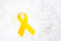 Yellow Ribbon on white background for supporting people living and illness. September Suicide prevention day, Childhood Cancer Royalty Free Stock Photo