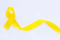 Yellow ribbon on white isolated background, copy space. Bone cancer, Sarcoma Awareness, childhood cancer awareness, Royalty Free Stock Photo