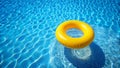 Yellow Ring Float in Swimming Pool Water Summer Vacation Royalty Free Stock Photo