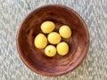 Yellow ripe lemons in bowl Royalty Free Stock Photo