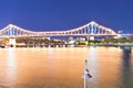 Yellow river and a city bridge at night Royalty Free Stock Photo
