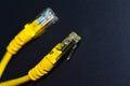 Yellow RJ-45 or ethernet internet cable on black background Royalty Free Stock Photo