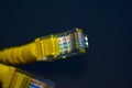 Yellow RJ-45 or ethernet internet cable on black background Royalty Free Stock Photo