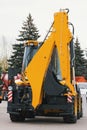 Yellow road constructor tractor - rear view