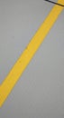 Yellow Road Line on Grey Asphalt Royalty Free Stock Photo