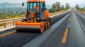 Yellow road roller compacting fresh asphalt on newly constructed road for smooth surface