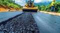 Yellow road roller compacting freshly laid asphalt on recently finished road surface Royalty Free Stock Photo
