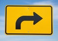 Yellow road sign with a black right-turn arrow. Rectangular shape with Royalty Free Stock Photo