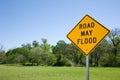 Road May Flood Sign In Summer With Green Trees And Grass. Royalty Free Stock Photo