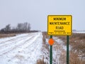 Yellow Road Sign warning of MINIMUM MAINTENANCE ROAD In rural Minnesota