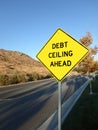 Yellow roadside warning sign reading debt ceiling ahead. Royalty Free Stock Photo