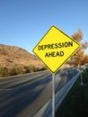 Yellow roadside warning sign reading depression ahead. Royalty Free Stock Photo