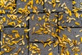 Yellow robinia leaves on sidewalk on a wet autumn morning