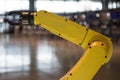 A yellow robotic arm