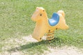 Yellow rocking spring Horse in the playground