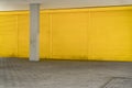 Yellow roller shutter and pavement for backgrounds Royalty Free Stock Photo