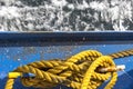 Yellow rope, or a mooring line on a ship. The colour contrast of blue and yellow is beautiful Royalty Free Stock Photo