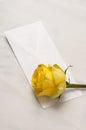 Yellow rose and letter