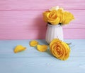 Yellow rose vase wooden background nature greeting decoration Royalty Free Stock Photo