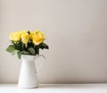 Yellow roses in white jug
