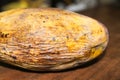 Yellow rotten mango fruit isolated on wooden