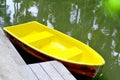 Yellow row boats in the lagoon or Yellow rowboat on water in lake with light of sunset Royalty Free Stock Photo