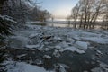 A yellow rubber boat stranded among ice floes floating down the river Royalty Free Stock Photo