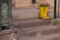 Yellow rubber boots in the flower beds on the stairs. Uchisar. Cappadocia, Anatolia, Nevsehir Province, Turkey Royalty Free Stock Photo