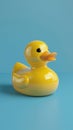 Yellow rubber duck on blue background. 3d render vertical