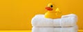 Yellow Rubber Duck on Stack of White Towels Royalty Free Stock Photo