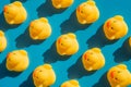 Yellow rubber ducks on a blue background with hard shadows Royalty Free Stock Photo