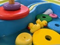 Yellow rubber ducks and rings floating in a play tray Royalty Free Stock Photo